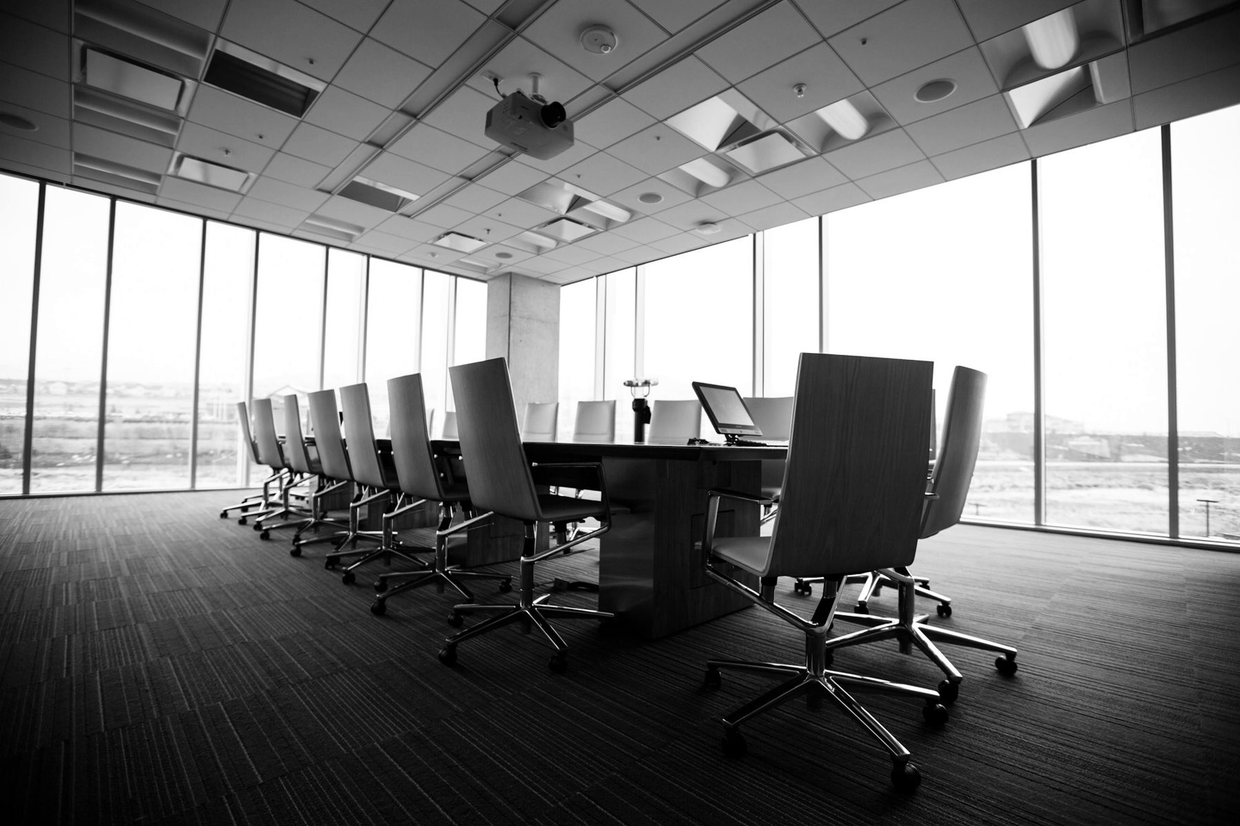 An empty boardroom behind closed doors