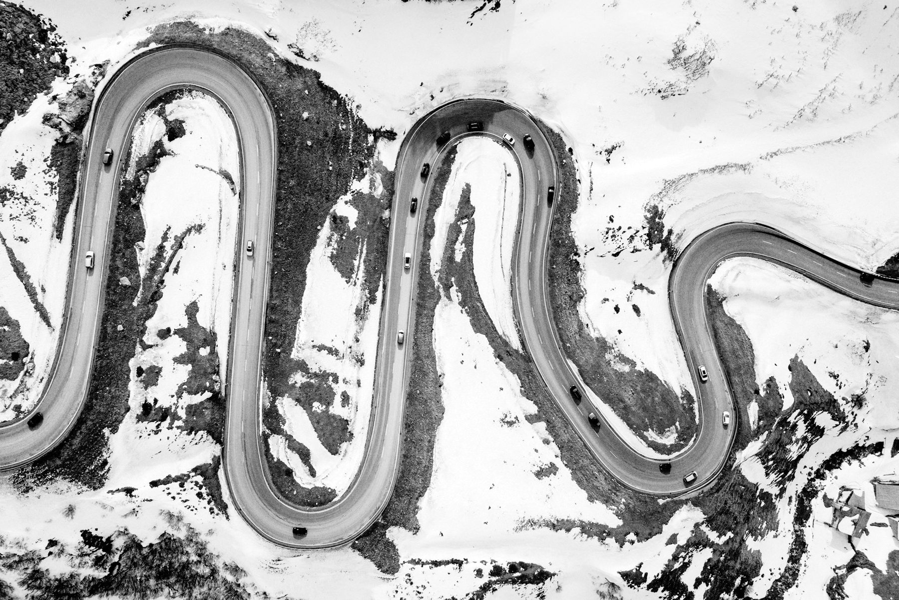 A single road winding through a snowfield